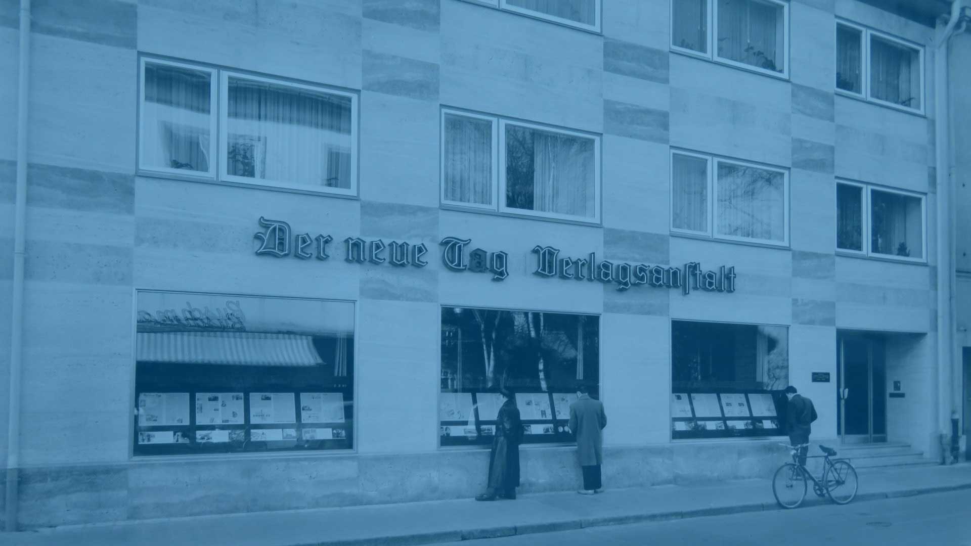 Bild aus der Geschichte von Oberpfalz Medien mit dem alten Verlagshaus mit der Aufschrift „Der neue Tag Verlagsanstalt“.